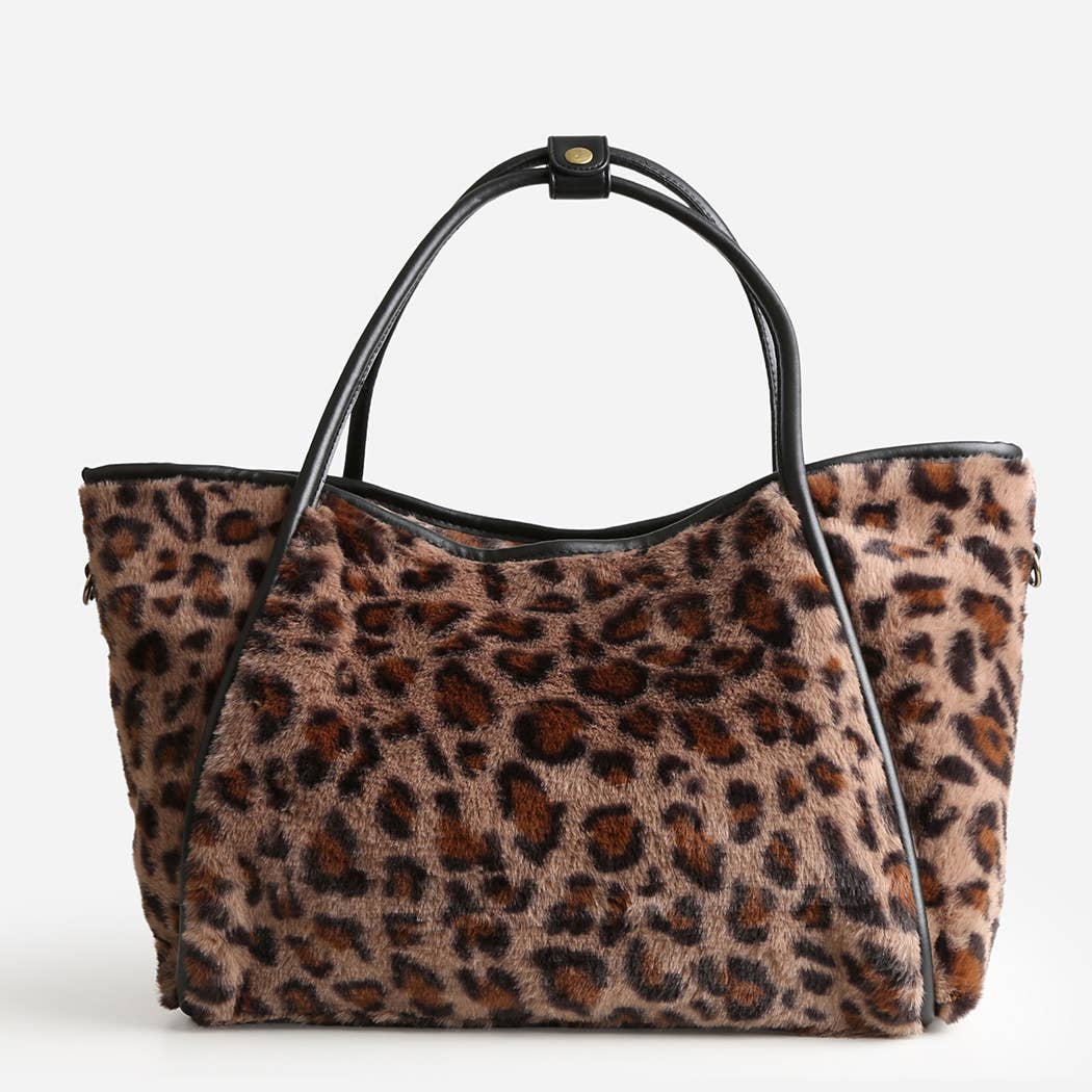 Leopard print handbag with black handle on a white background