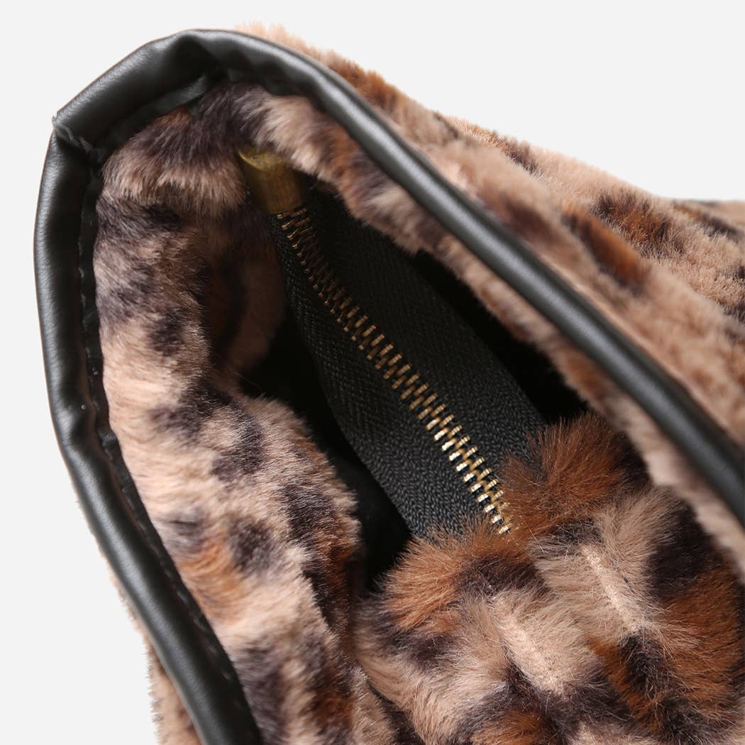 Close-up of a leopard print pouch with a black zipper on a white background