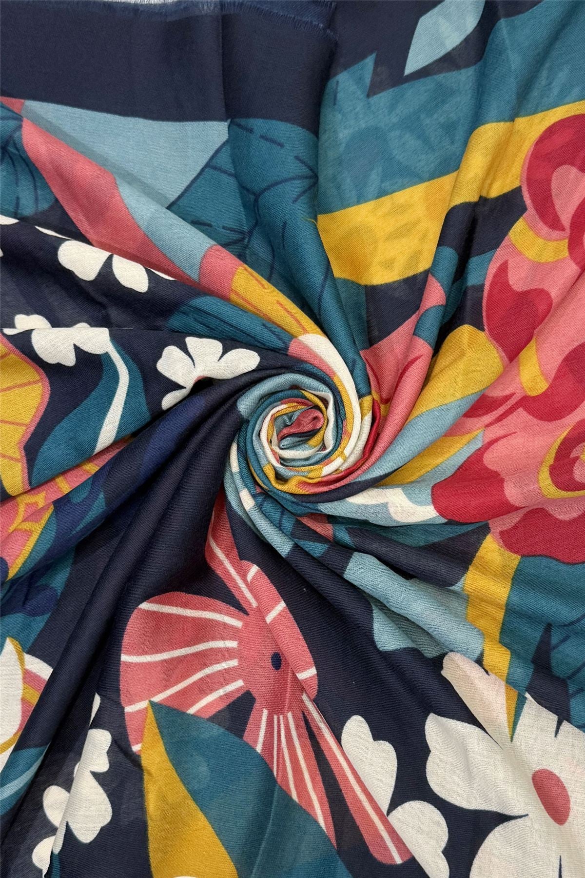 Colorful fabric with floral and abstract patterns in a swirl.