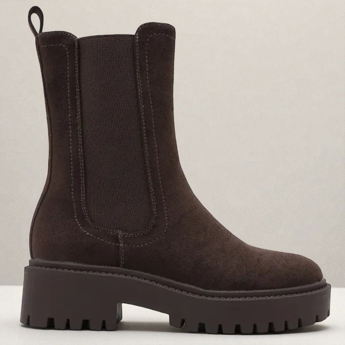 Brown Chelsea boot on a white background