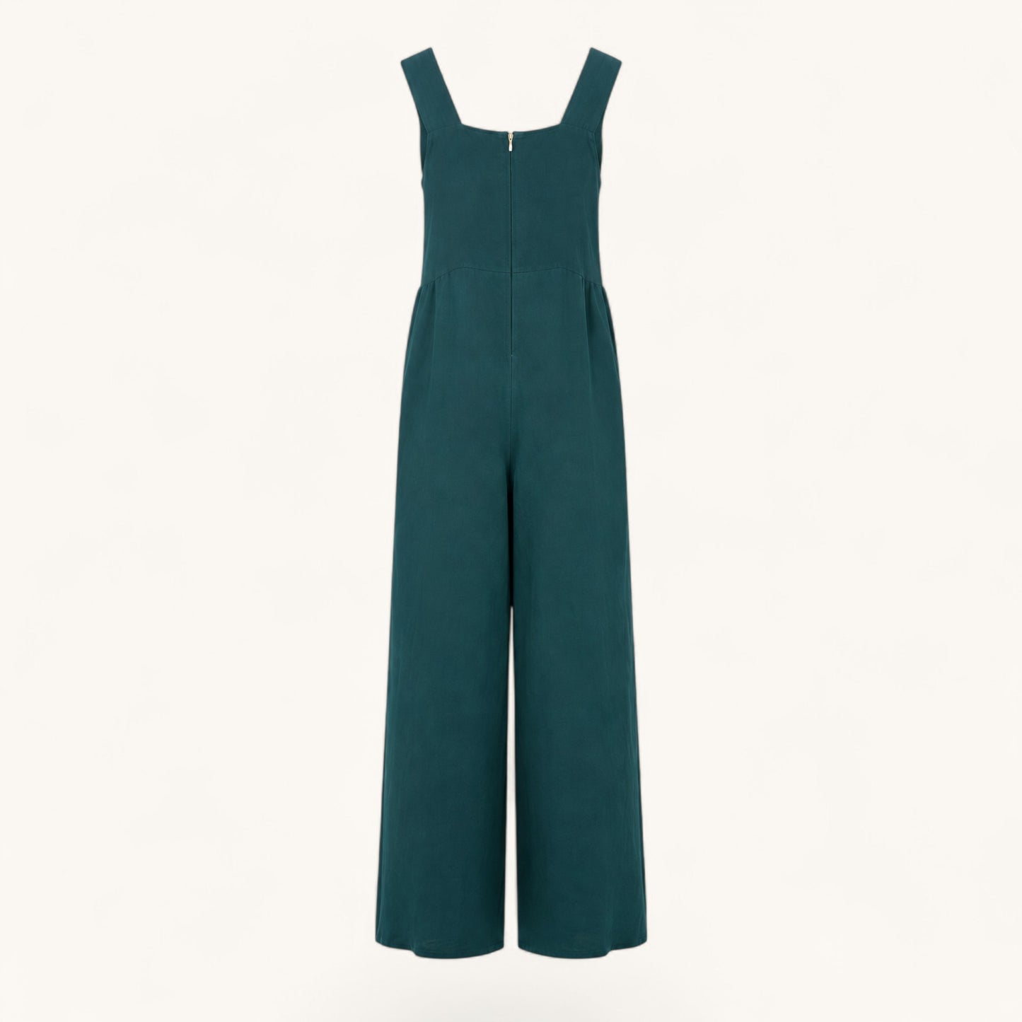 Feather & Sole teal linen jumpsuit featuring a square neckline, wide legs, and a back zipper closure.