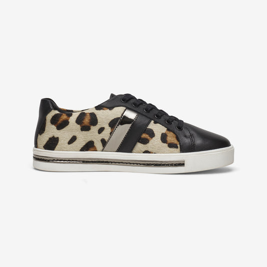 Side view of wide fit leather lace up trainer in snow leopard print