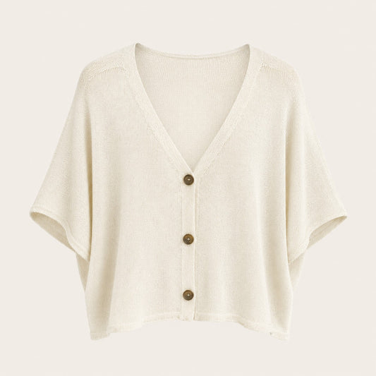 Feather & Sole cream knit cardigan with a V-neck, short wide sleeves, and contrasting dark buttons.