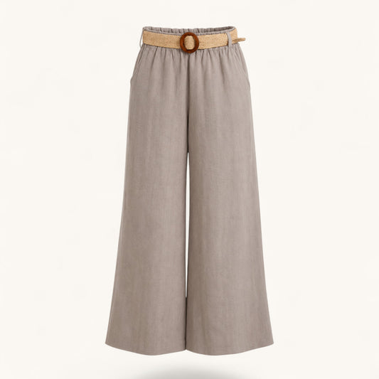 Feather & Sole taupe linen trousers with an elasticated waist and raffia belt.