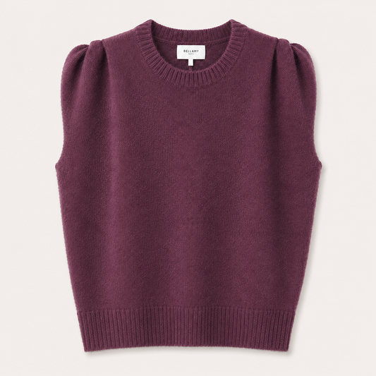 A sleeveless knit sweater vest in a deep plum purple color, featuring puffed shoulders, a crew neckline, and ribbed trim, shown flat against a light cream background. The brand name BILLABY is visible on the inner neck label.
