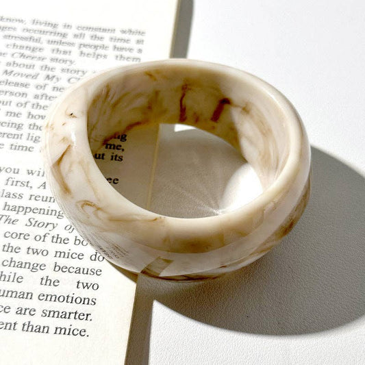 Marbled ring on a book page