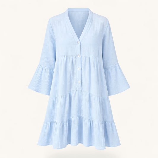 Feather & Sole light blue tiered short dress in 100% cotton gauze with a V-neck and button-front closure.