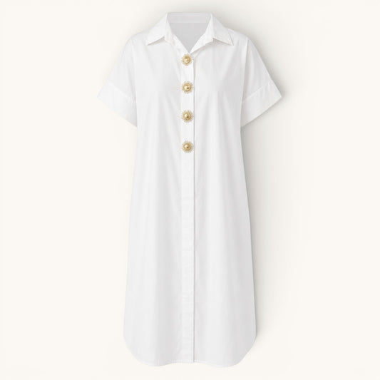 Feather & Sole white oversized cotton shirt dress with short sleeves and decorative gold sunburst buttons.