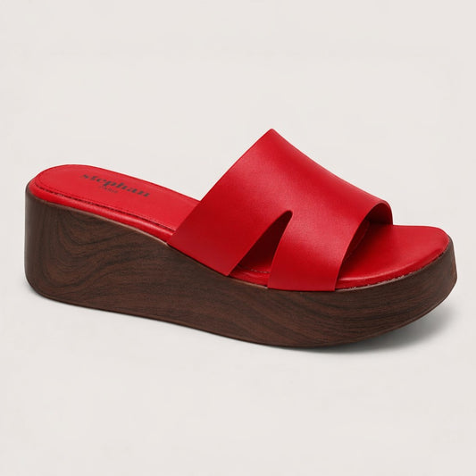Feather & Sole red leather flatform mule sandals with cut-out strap and wood-grain effect sole.