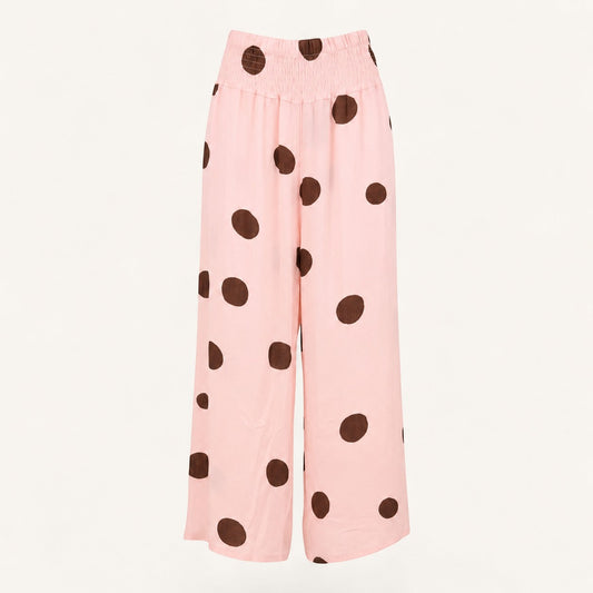 Feather & Sole pink linen trousers with brown polka dots and elasticated waistband.