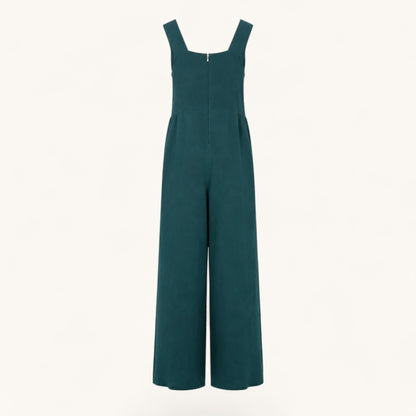 Feather & Sole teal linen jumpsuit featuring a square neckline, wide legs, and a back zipper closure.