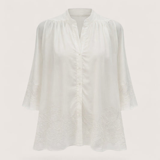 Feather & Sole white embroidered band collar blouse with floral details on hem and cuffs.